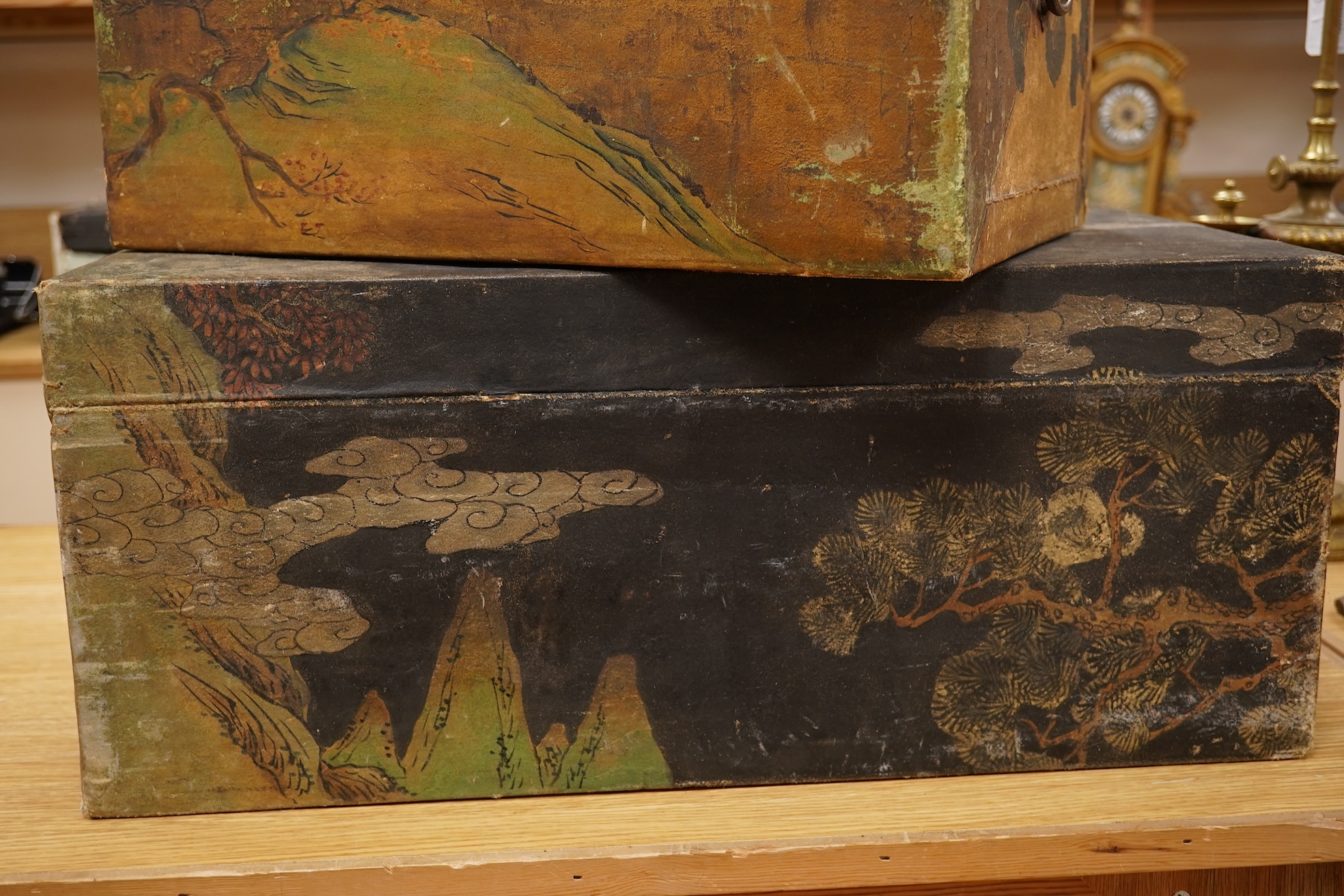 Two Chinese polychrome decorated hide chests, largest 56cm wide